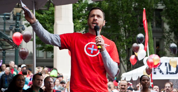 Michael Kaplan, Executive Director of Cascade AIDS Project asks for a moment of silence in memory of the 600,000 lost to HIV in the US over the past 30 years.