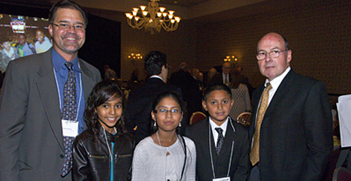 President and CEO, Mark Langseth, with Alder Elementary Dreamers Abril Sierra, Giselle Amrosio, Jonathan Guerrero, and Greg Chaillé, celebrate the evening during the Dinner Program. The Alder Elementary Dreamers were on-hand to present the platters that they and their classmates designed and created with the help of Polly Spencer.