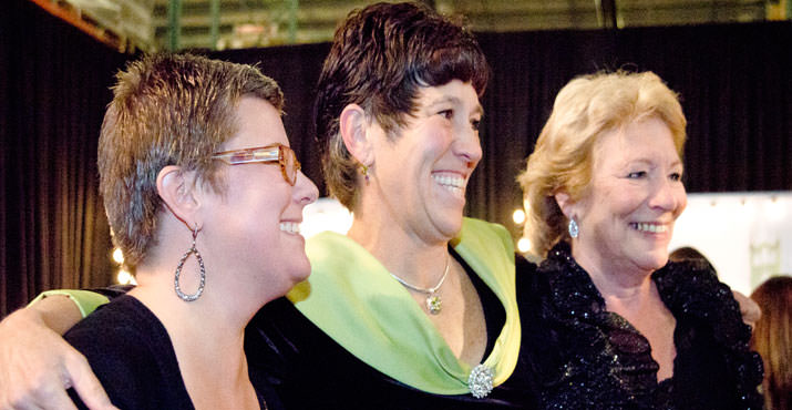 Caption: Karla Wenzel, chair of Oregon Food Bank Board of Directors, (center) congratulates co-chairs Lisa Sedlar, CEO, New Seasons Market, (left) and Syd Hannigan, retired Safeway executive, at Oregon Food Bank’s annual gala fundraiser, Oct. 16.