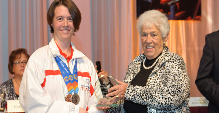 Gert Boyle presenting the Shriver Greatness Award to Special Olympics Oregon World Game athlete, Christy Clark.