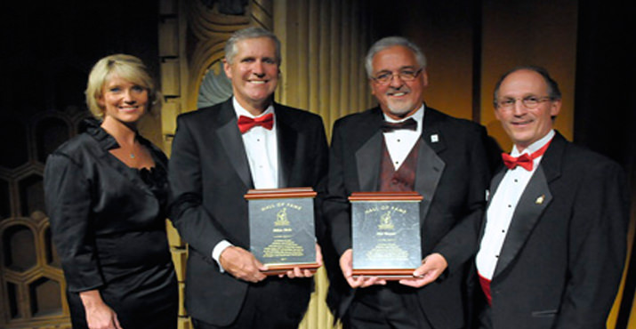 Board Chair Mary Ransome (left) and Executive Director Tom Soma (Right) pose with Hall of Fame inductees Mike Rich (center left) and Jim Boyer (center right) who were recognized for their outstanding individual involvement with RMHC. 