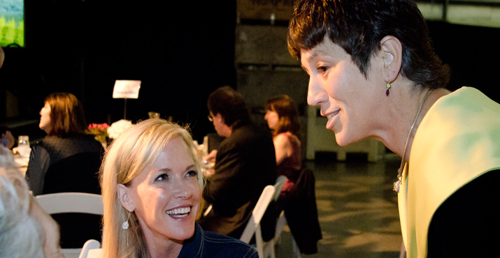 Gala emcee, Sheila Hamilton of 101.9 KINK.fm, chats with Karla Wenzel, chair of the Oregon Food Bank Board of Directors, at “Home Grown,” Oregon Food Bank’s annual gala fundraiser, Oct. 15.