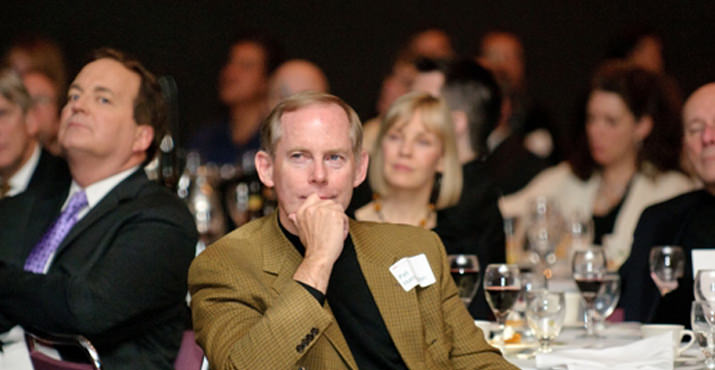 Event co-chair Pat Harrington, managing principal of Boora Architects, finds inspiration in Greg Chaille's address.
