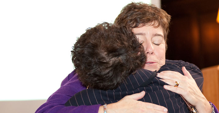 Federal Judge Honorable Ann Aiken hugging Retired Senator Margaret