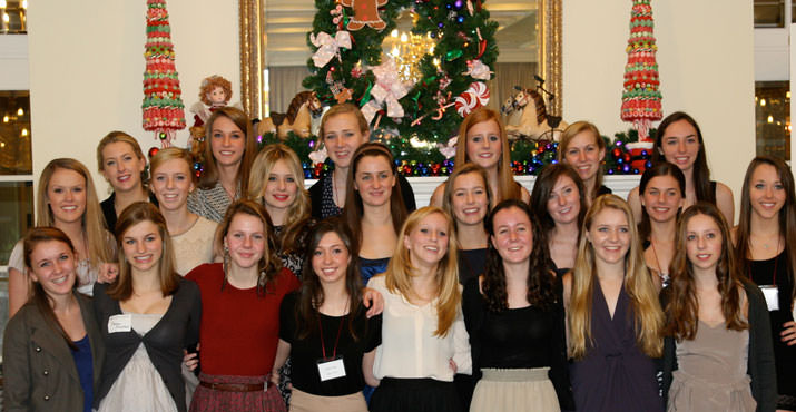 Members of the class of 2013 help serve at the annual holiday tea