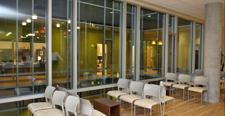 Second floor waiting area near the atrium which allows increased natural lighting contributing to the building's Gold LEED rating.