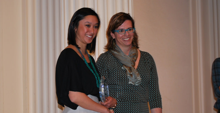 Amanda Ip, Special Projects Coordinator at Fred Meyer, congratulates Adrienne Karecki from Central City Concern. The Volunteer Corps from Central City Concern won the Volunteer Innovation Award