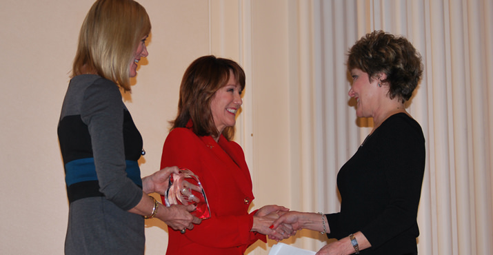 Priscilla Lewis. Executive Director for Community Services and Development at Providence Health & Services and KGW’s Laurel Porter congratulate winner Terry Clelen. Terry won the Hands on Greater Portland Volunteer Award