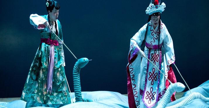 Green Snake (Tanya McBride) and White Snake (Amy Kim Waschke) ride the clouds to the earth below. Photo: Jenny Graham.