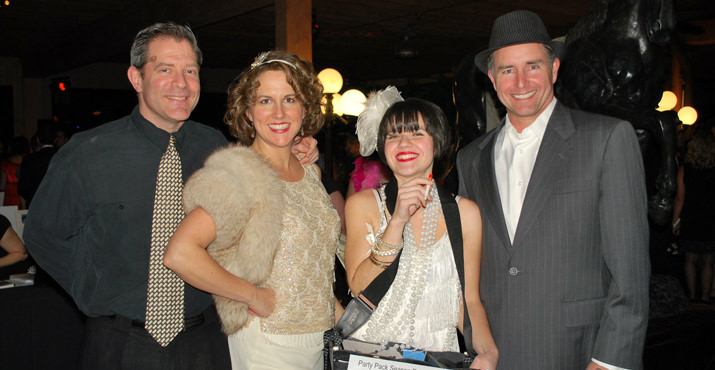 John Bogaty and PTC President-Elect Heather Bogaty posed with volunteer "Cigarette Girl/raffle salesperson" Erica Naito-Campbell and Riverdale Foundation Board Member Steven Klein