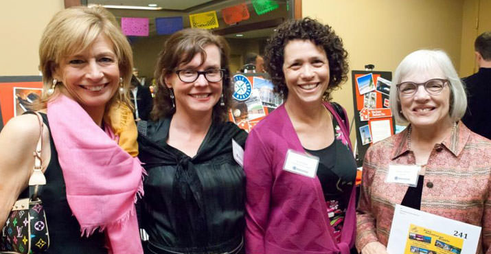 Neighborhood House Board Members Jane Packard, Beth Blenz-Clucas, Pam Field and Linda Gerber get festive at Neighborhood House's annual