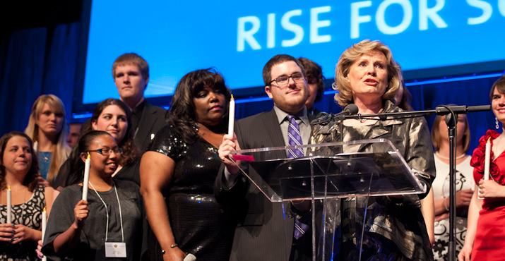 Nancy Bryant, co-chair of the RISE Campaign, asks those in attendance to support scholarships at UP. Bryant announced that University regent Mary Boyle and her husband Tim Boyle were providing a $100,000 matching gift. Other major sponsors of the event were Fedele Bauccio ’64, ’66 MBA and his company Bon Appetit Management Company, Allen and Kathleen Lund, Steve ’58 and Donna Shepard, Darlene Marcos Shiley, and Bill Tagmyer & Lucy Martin (in honor of Fred and Sue Fields).