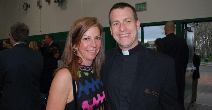 Auction co-chair Gigi Van Rysselberghe with Father Paul Grubb