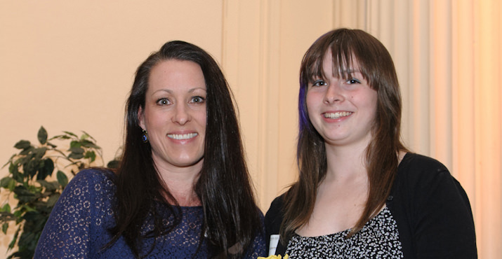 Rebecca and Emelyn Roberts receive an award for mother and daughter community service