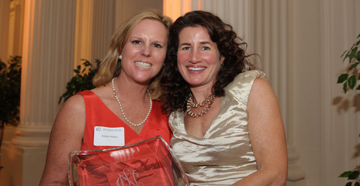 Julia Hall receives the Oregon Rose Award from President Karen Holce