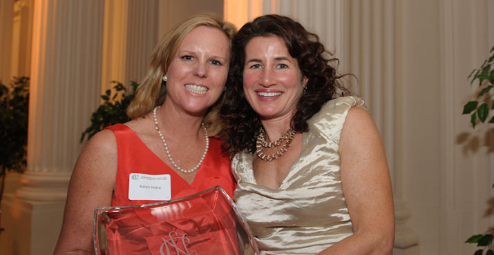 Julia Hall receives the Oregon Rose Award from President Karen Holce