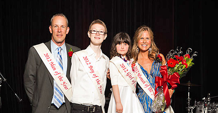 Top fund raisers "Man of the Year", Matt Elmgren from Mercer and "Woman of the Year", Julie Peterson from Pinnacle Capitol Mortgage stand aside "Boy and Girl of the Year", Cyrus Zentzis and Karina Miziolek. The children provide inspiration to the candidates during the campaign.