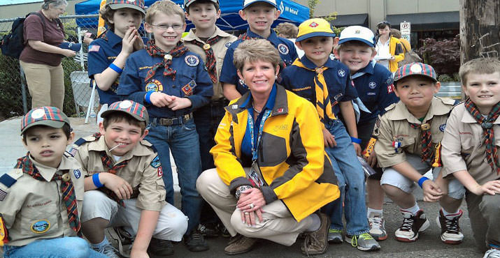 Rose Festival President Sue Bunday and Scout Pack 221 before today's Fred Meyer Junior Parade. This is the Pack's 21st year as the parade Color Guard!