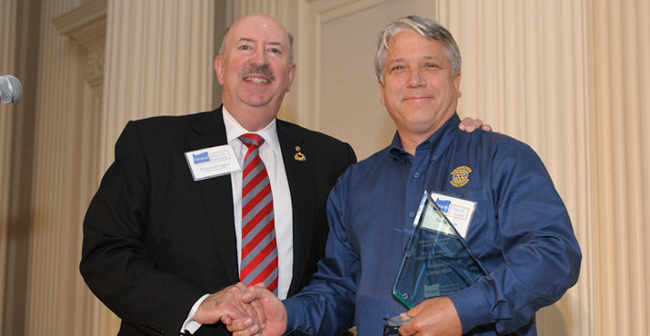 Rotary Club of Portland President Dick Wingard and Award Recipient George Rode. 