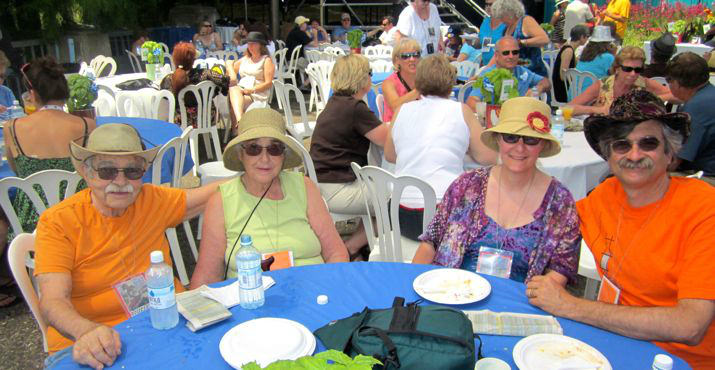 Charles and Caryl Fuchs, smile with Kyle and Charlie Fuchs in the sponsor's tent.  Big time donors Charlie and Kyle brought Charlie's parents to enjoy the event!