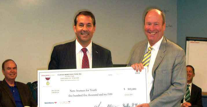 Brian Rice (New Avenue's Board President and KeyBank District President), and Roger Hinshaw (CWA Board Member and Bank of America president of Oregon & Southwest Washington) display the over-sized check of $505,000 presented to  New Avenues for Youth from the Classic Wines Auction. 