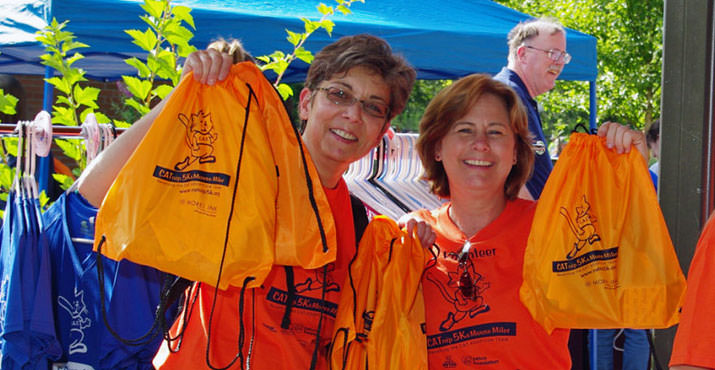 CAT staffers help out - Pamela and Liz offer participants one of our awesome swag bags.