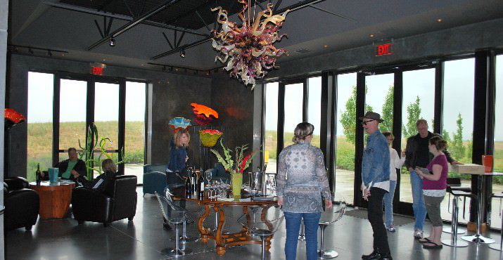 The new Long Shadows winery and tasting room are dramatically located on a hill with a grand view of surrounding countryside with very simple modern architecture highlighted by Dale Chihuly's glass art including a chandelier and several large organic pieces.