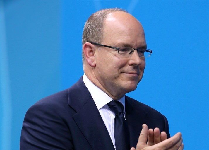 Prince Albert II of Monaco presents medals on the podium during the Victory Ceremony following the women's 400m Freestyle final on Day 2 of the London 2012 Olympic Games at the Aquatics Centre.
