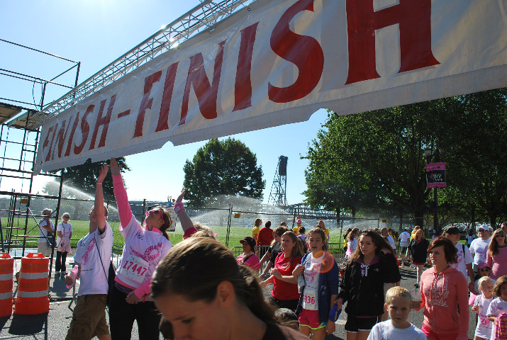 Touching the finish line banner is a tradition for many