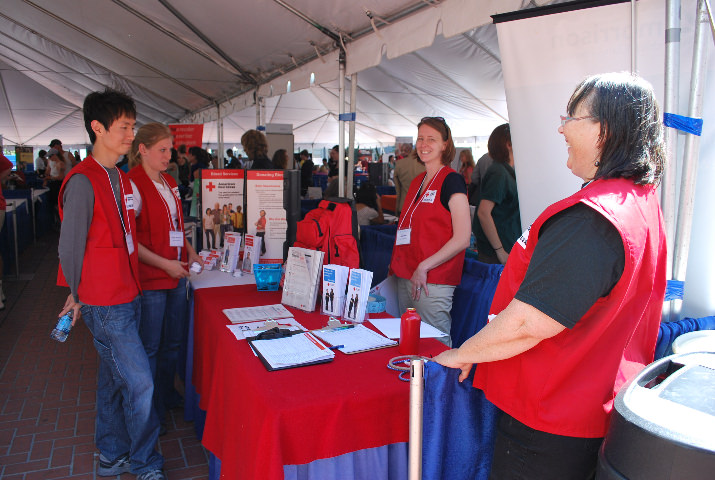 American Red Cross volunteer recruiters had the trademark red vests!
