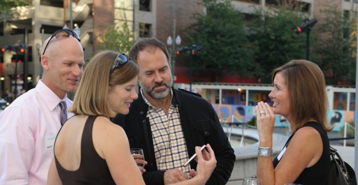 Randy and Heather Koch catch up with Scott Hall and Tamara Amey.