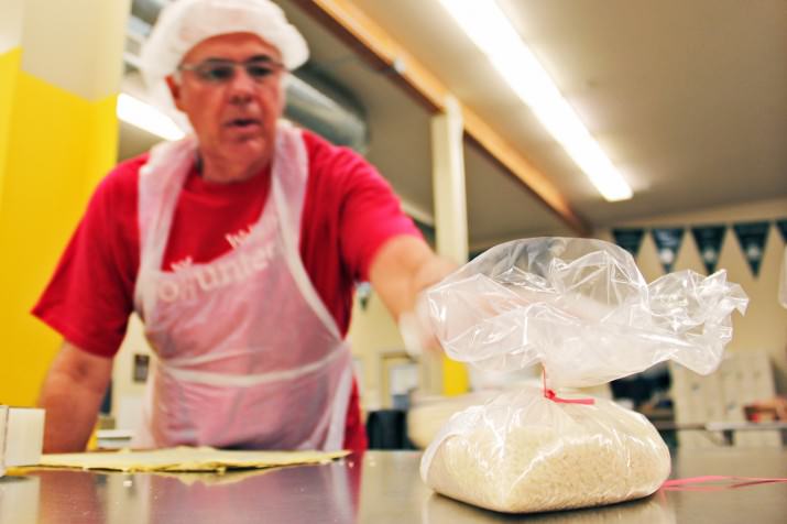 Rocky Norris repacks food at the Oregon Food Bank’s Maybelle Clark Macdonald Volunteer Action Center