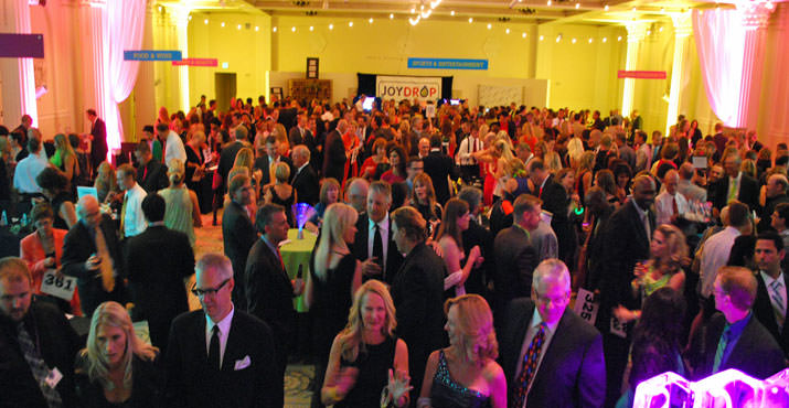 Upbeat Children's Cancer Association supporters filled the silent auction area. 