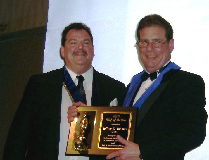 President Anthony Danna presenting Chef JD Thomas his plaque to keep for being the 2011 Chef of the Year recipient.