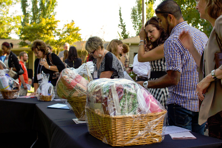 A number of baskets were up for grabs in the evening’s silent auction, featuring gift certificates from local businesses, hand-made gifts by our residents and board members, and even a weekend getaway! (photo credit: Zach Reitan)