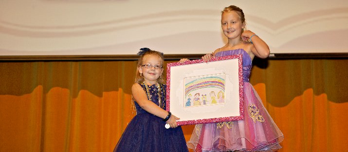 Make-A-Wish recipients Ella Grace Edmondson and Lily Moser – Caption: Wish recipients Ella Grace Edmonson (left) and Lily Moser (right) auction off Ella’s art