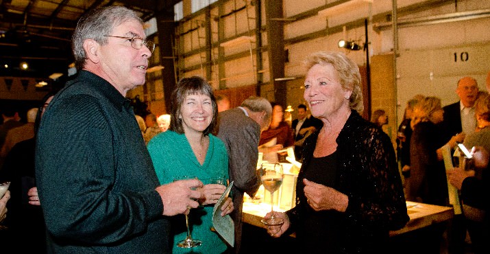 Ron Johnson, member of Oregon Food Bank’s Board of Directors, and his wife Gayl Johnson talk with Syd Hannigan, fellow board member and co-chair of Oregon Food Bank’s 2012 Oregon Harvest Dinner, Oct. 20, in the Rachel M. Bristol Warehouse at Oregon Food Bank’s headquarters in northeast Portland.  The event is Oregon Food Bank’s biggest fundraiser after the Waterfront Blues Festival. Photo by Sarah Jo Galbraith. 