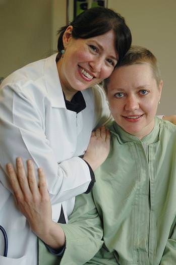 Katherine Morris, MD, Surgical Oncologist, volunteer physician and medical director of Project Access Multnomah County, with a client