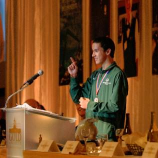 Special Olympics Oregon athlete, Travis Koski, address the audience and thanks everyone for their support of Special Olympics Oregon programs and services. Travis is a gold medal winner in the pentathlon, enjoys public speaking and hanging out with his friends.