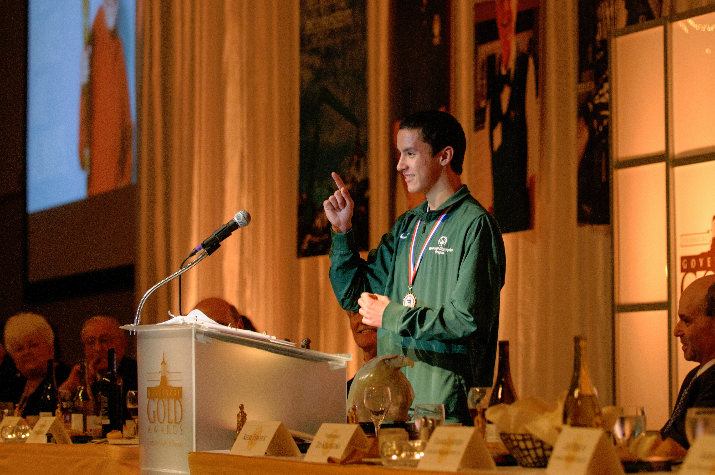 Special Olympics Oregon athlete, Travis Koski, address the audience and thanks everyone for their support of Special Olympics Oregon programs and services. Travis is a gold medal winner in the pentathlon, enjoys public speaking and hanging out with his friends. 