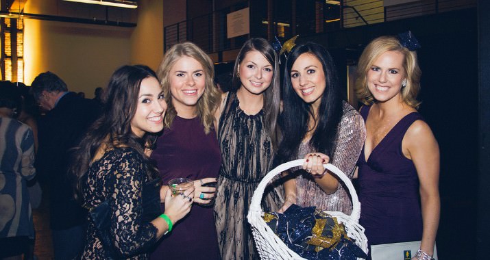 Levé board president, Megan Dobson (second from right), sells flair at the Ball. She joined by committee member Abby Lee (far right), marketing & communication chair Natasha Dagg (center) and two event guests.