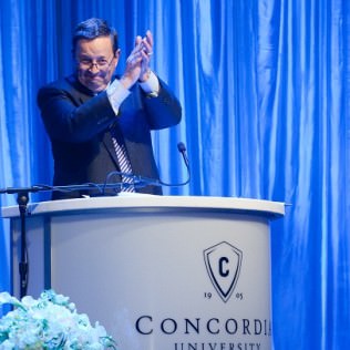 Concordia University President Charles Schlimpert at the podium.