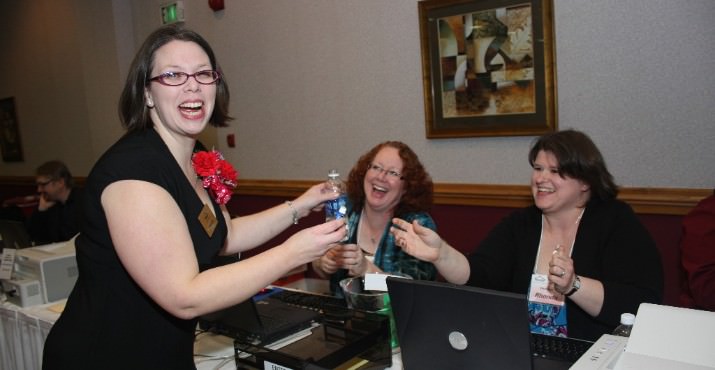 Kirsten Wageman(L to R) coordinated SnowCap's 11th Annual Valentine’s Dinner Auction at the Holiday Inn Portland-Airport on February 9th. She thanked all the supportive volunteer cashiers including Debra Robertson and Rhonda Rowan (shown) who assisted ringing up a record breaking $94,000 for SnowCap to provide food boxes to 8,000 people per month in east Multnomah County.