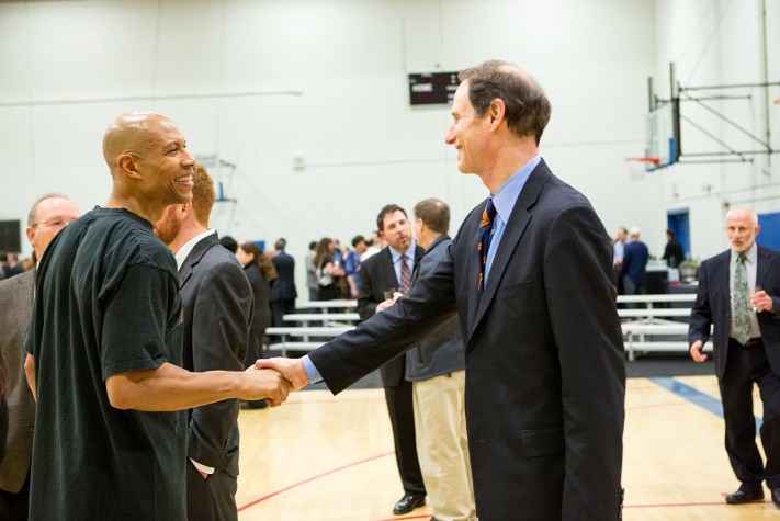 Former Portland Trailblazer Darnell Valentine greets Senator Ron Wyden for some basketball fun at the MJCC Friends of the Center Dinner on February