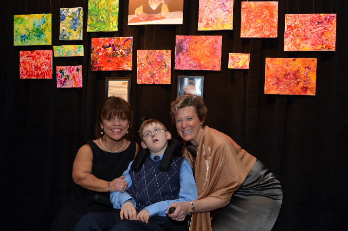 Amy Roloff, left, star of TLC’s reality show “Little People, Big World,” poses with Michelle Kennedy and her son, Evan Kennedy at the 2013 Heart of Gold event on Feb. 21. Michelle and Evan use the resources at the Swindells Center and visit Providence Neurodevelopmental Center for Children for speech and other therapies.
