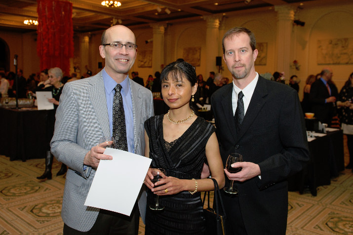 Mark Stevenson (Sponsor, Capital Pacific Bank) with Jilma Meneses (Northwest Academy Trustee and Alumni Parent) and her husband Nathan Reynolds