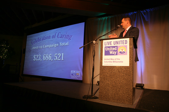 Andrew Frazier, managing partner of Frazier Hunnicutt Financial and 2012-13 Fundraising Committee Chair, with the campaign total.