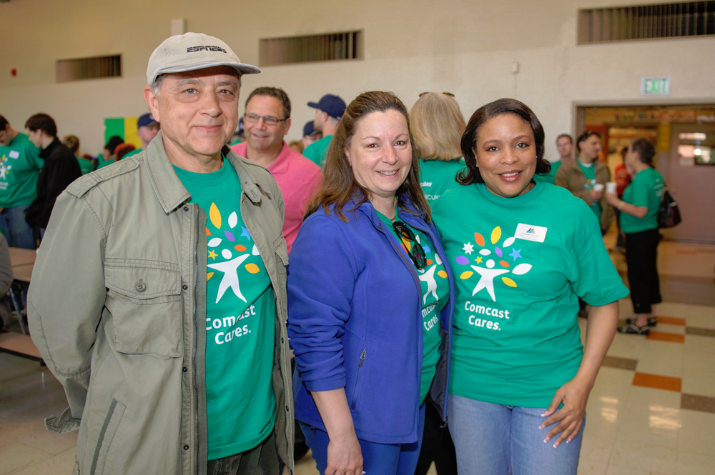 John Avgiris and Cathy Avgiris, Comcast executive VP & general manager of communications & data services, joins Multnomah County Commissioner Loretta Smith at Faubion School for a day full of gardening, painting and cleaning and Faubion School. Photo by Andie Petkus.