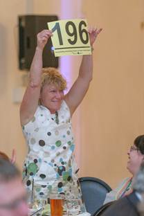 Excited bidder Cherie Siegmund, owner of Cedarglen Floral.