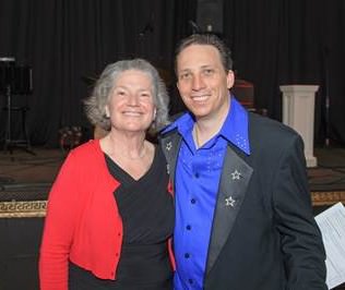 Carla Piluso, Human Solutions Board President, and entertainer Tony Starlight.